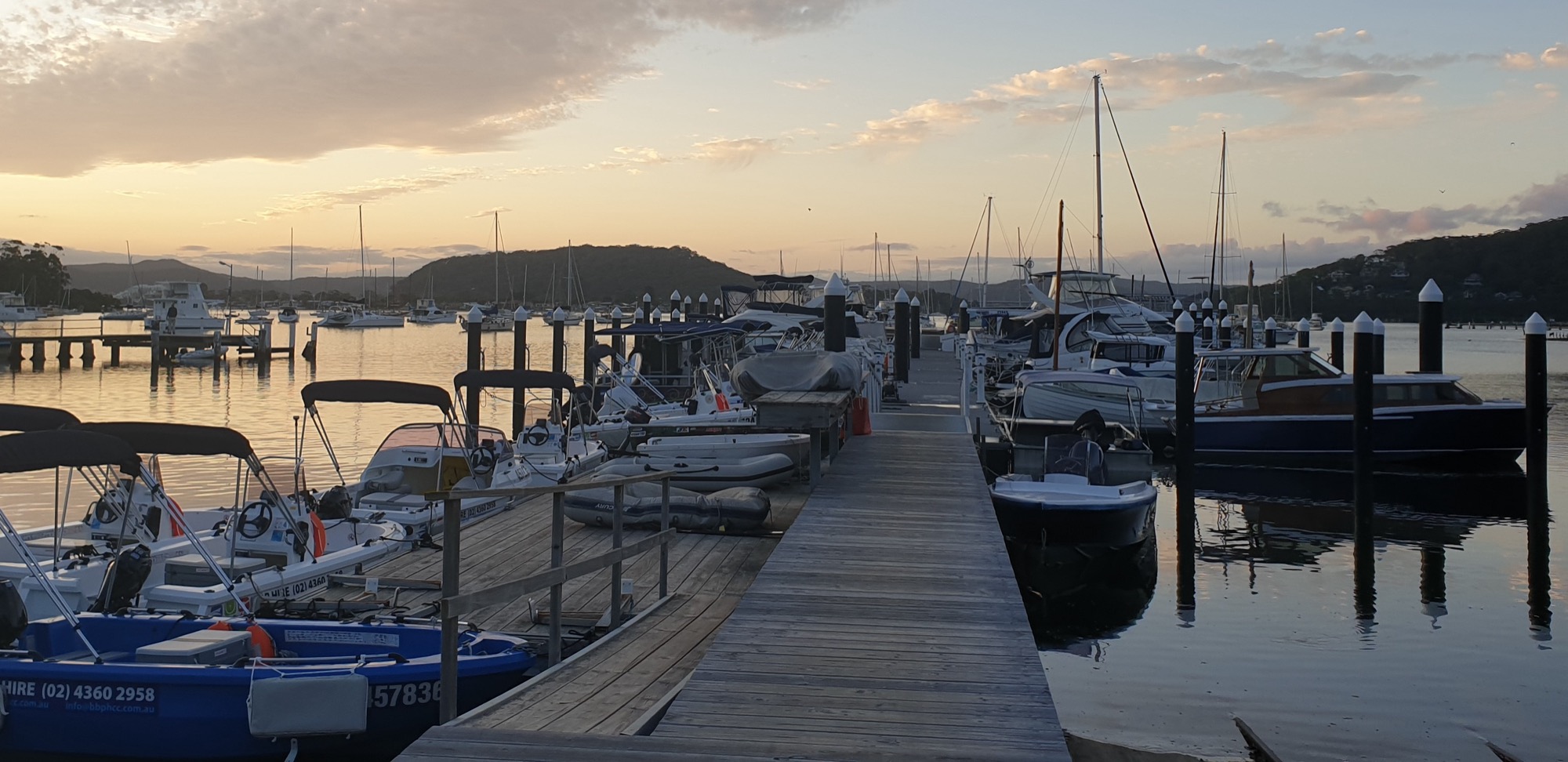 Sunrise over the jetty and the hire boats